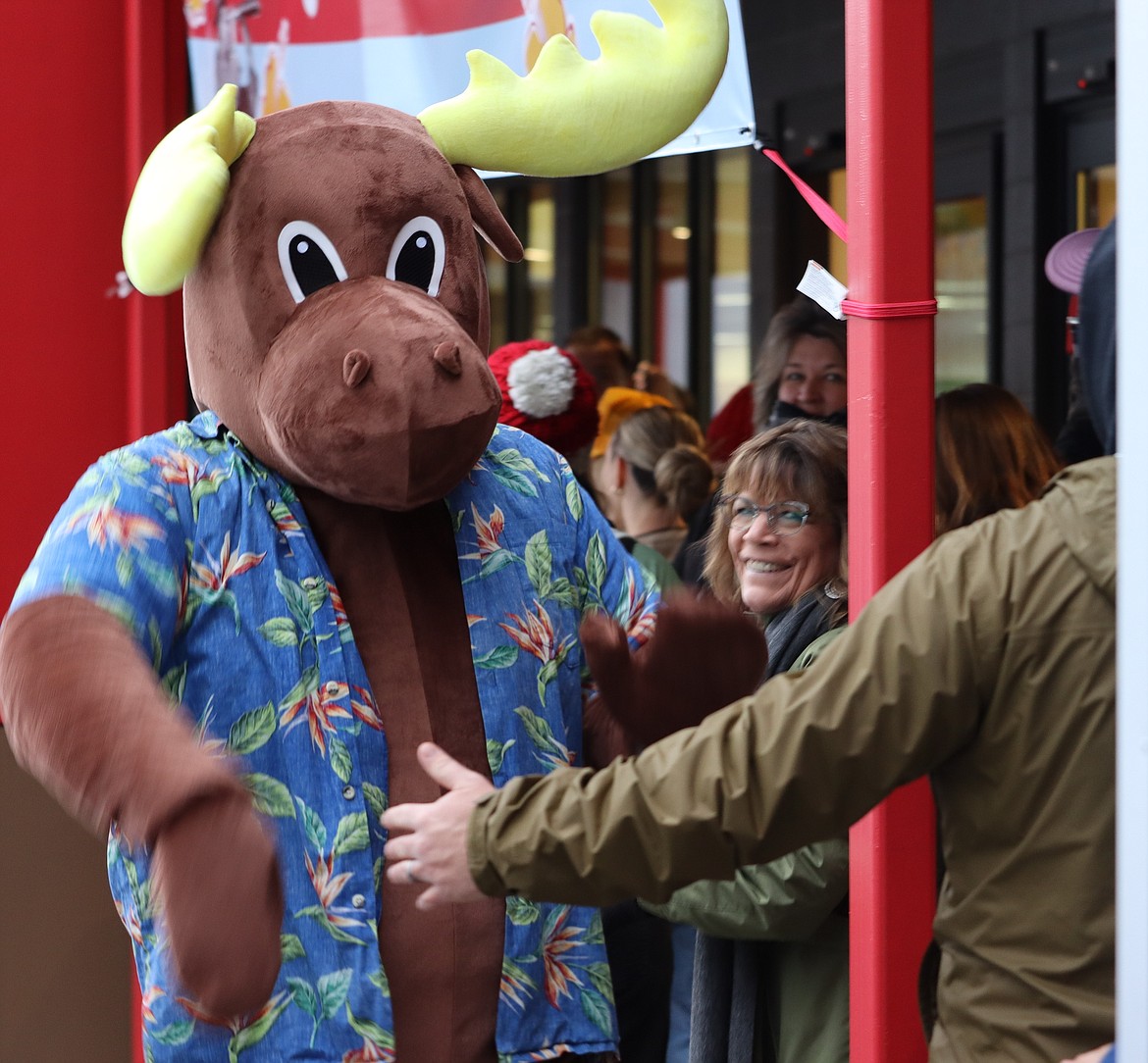 A moose greets customers outside Trader Joe's on Tuesday.