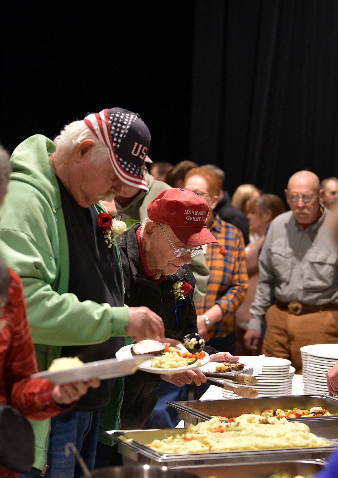 Veterans enjoy a meal prepared by Whitefish High School culinary students Nov. 11. (Kelsey Evans/Whitefish Pilot)