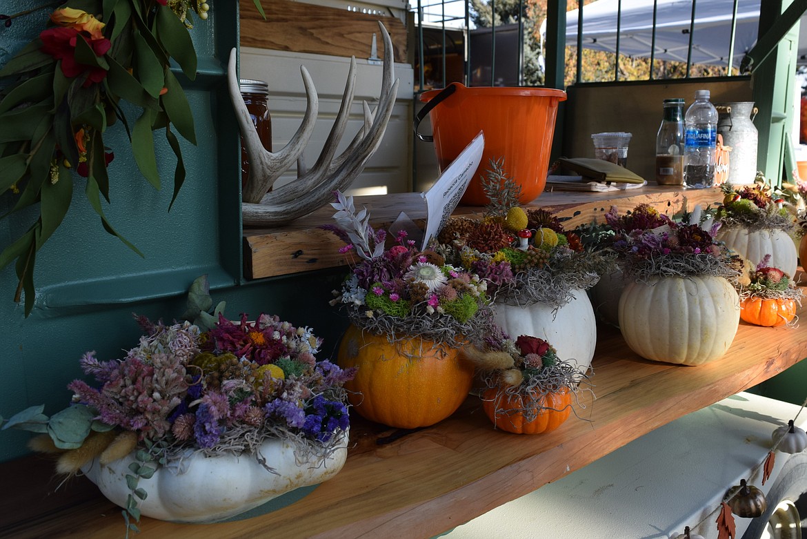 A stand at the Oct. 26 farmers market was selling pumpkins with dried flowers. The upcoming Harvest Market will have other homemade goods from over 30 vendors.