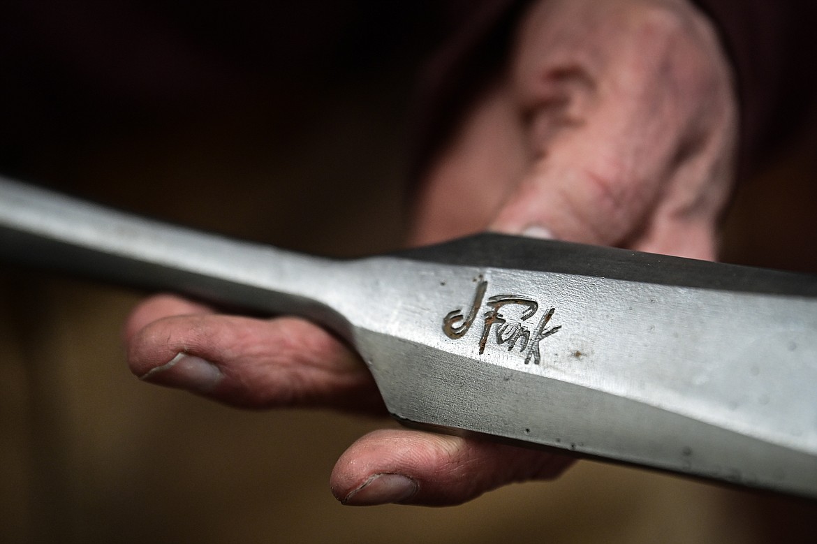 Jeffrey Funk holds a Japanese-style chisel called a slick that was forged from wrought iron inside his workshop in Bigfork on Tuesday, Nov. 12. (Casey Kreider/Daily Inter Lake)