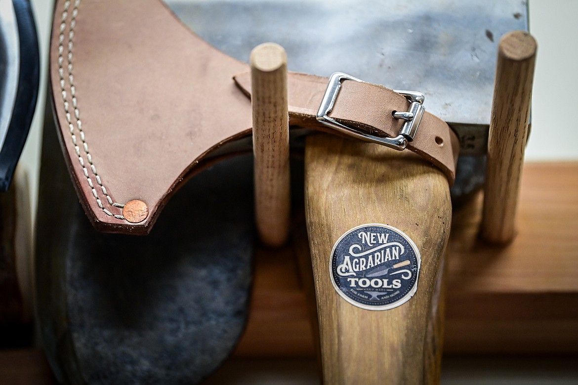 An axe with a New Agrarian Tools label inside Jeffrey Funk's workshop in Bigfork on Tuesday, Nov. 12. (Casey Kreider/Daily Inter Lake)