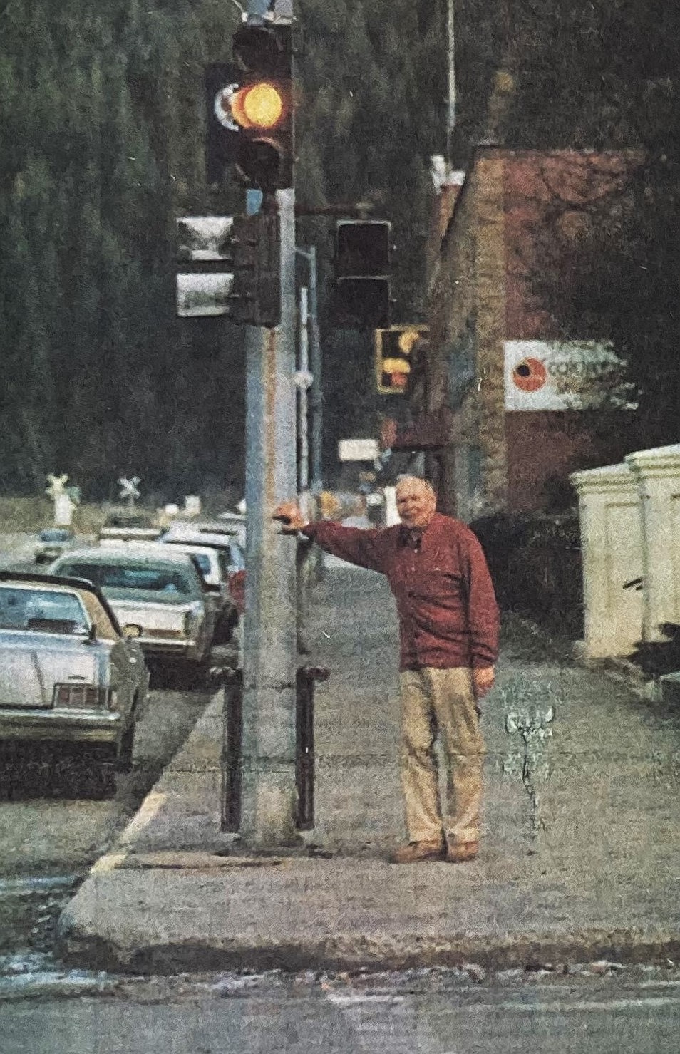 In 1984, Wallace Mayor Frank Morbeck stands with the last Interstate 90 stoplight between Seattle and Boston.