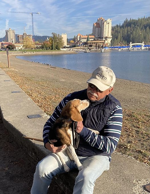 In fall 2024, Dave Oliveria and his prized beagle, Huckleberry, enjoy the sun at City Beach.