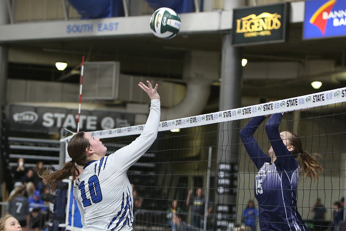 Soap Lake junior Brooke Dana (10) tips the ball over the net against Pe Ell Wednesday morning at the Yakima Valley SunDome.