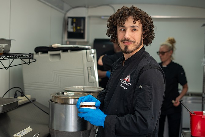 NIC student Finnegan Vitale prepares an order on April 24 in the NIC Food Truck at NIC’s Coeur d’Alene campus. Photo courtesy of North Idaho College.