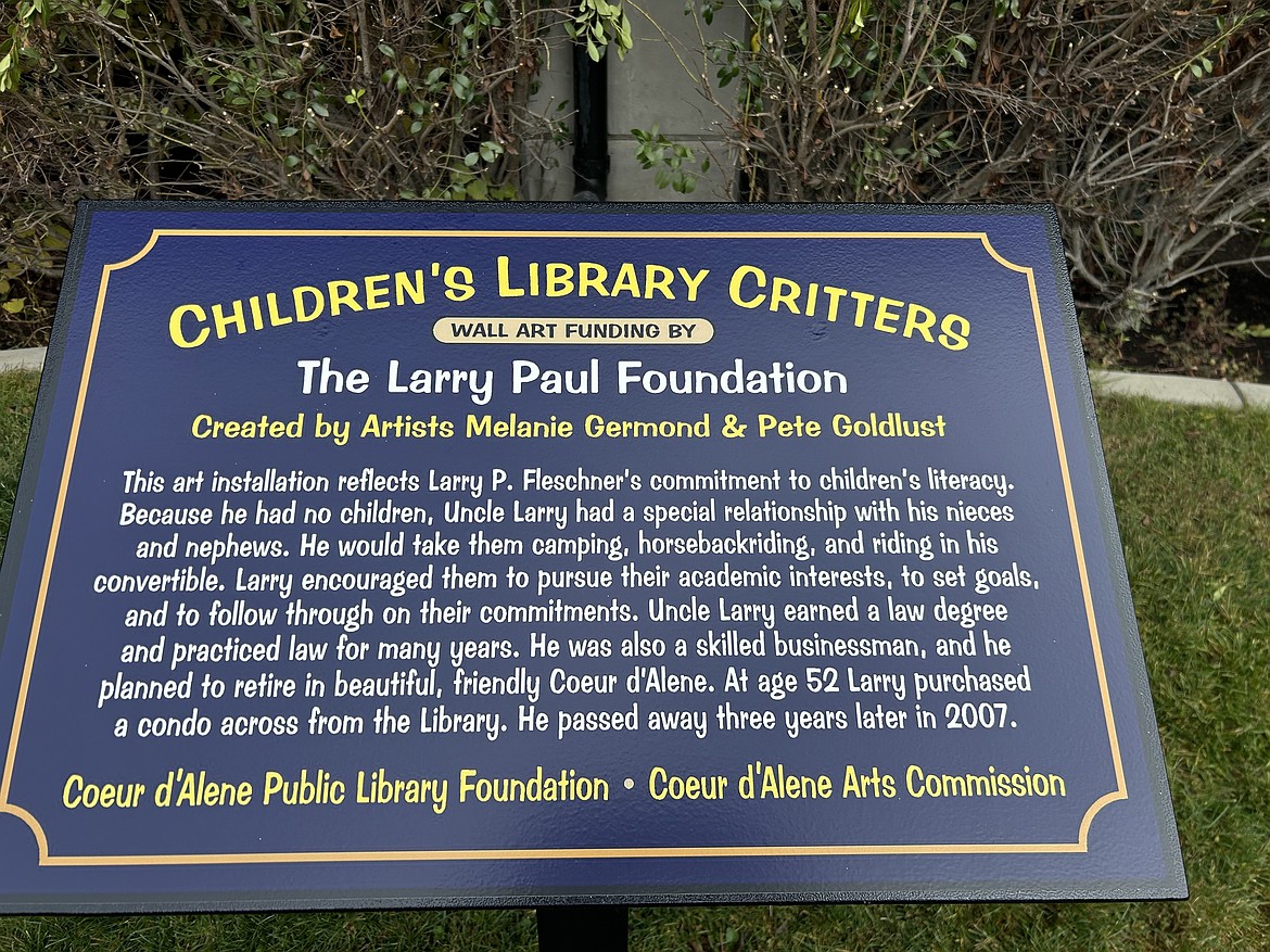 A plaque commemorates the artwork outside the Coeur d'Alene children's library on Thursday.