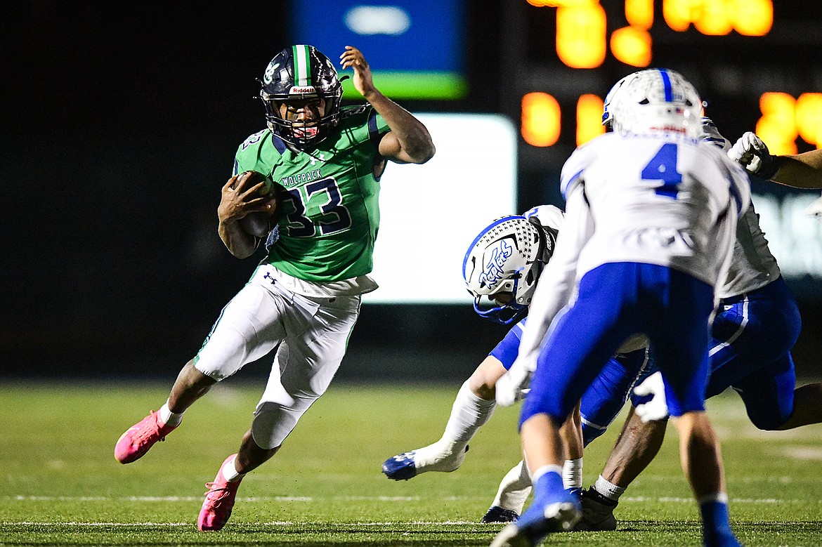 Glacier running back Kobe Dorcheus (33) looks for running room on a carry in the first quarter against Gallatin in the Class AA semifinals at Legends Stadium on Friday, Nov. 10. (Casey Kreider/Daily Inter Lake)