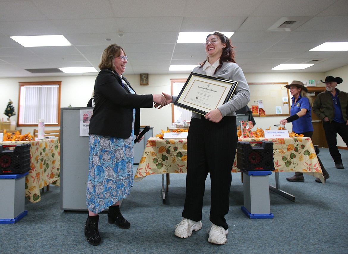 Daughters of the American Revolution Lt. George Farragut Chapter Regent Michelle Fansler shakes Bardenay assistant general manager Korrin Ator-Hudson's hand Friday after presenting her with a community service award in recognition of Bardenay's longstanding partnership with the nonprofit.