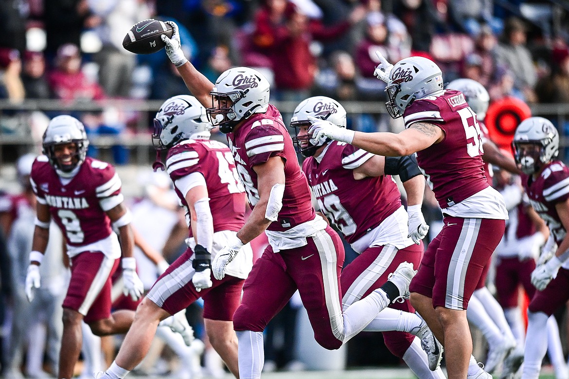 Grizzlies defensive end Hayden Harris (48) celebrates with teammates after recovering a fumble by Portland State quarterback Dante Chachere in the fourth quarter at Washington-Grizzly Stadium on Saturday, Nov. 16. (Casey Kreider/Daily Inter Lake)