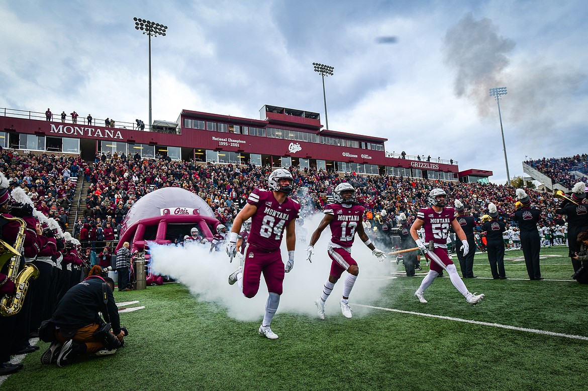 The Montana Grizzlies run out of Topel Tunnel before the start of their matchup with the Portland State Vikings at Washington-Grizzly Stadium on Saturday, Nov. 16. (Casey Kreider/Daily Inter Lake)