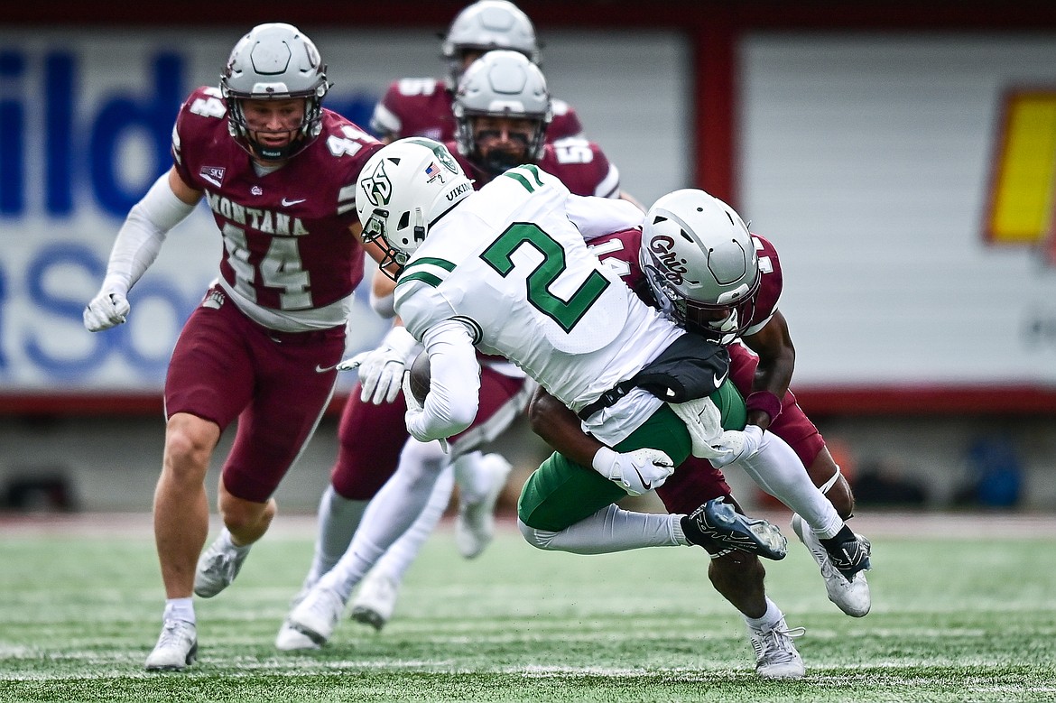 Grizzlies cornerback Kyon Loud (14) wraps up Portland State wide receiver Branden Alvarez (2) after a reception in the first quarter at Washington-Grizzly Stadium on Saturday, Nov. 16. (Casey Kreider/Daily Inter Lake)