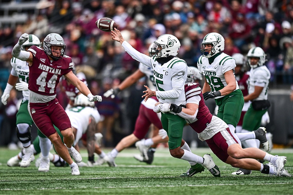 Grizzlies linebacker Riley Wilson (42) hits Portland State quarterback Dante Chachere (15) in the third quarter at Washington-Grizzly Stadium on Saturday, Nov. 16. (Casey Kreider/Daily Inter Lake)