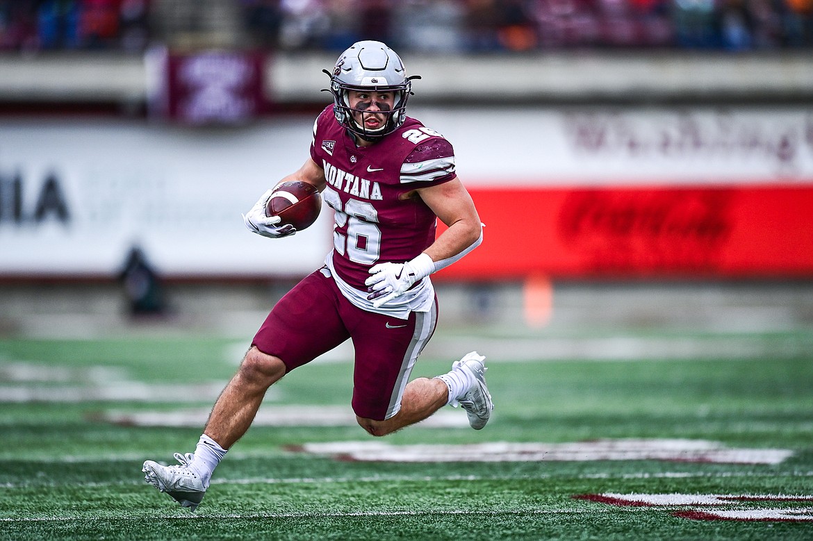 Grizzlies running back Nick Ostmo (26) picks up 11 yards on a reception in the third quarter against Portland State at Washington-Grizzly Stadium on Saturday, Nov. 16. (Casey Kreider/Daily Inter Lake)