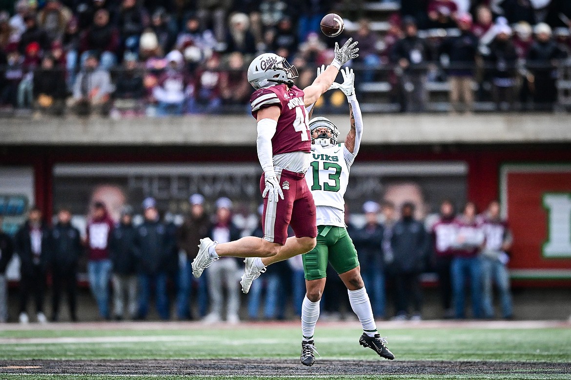 Montana linebacker Ryan Tirrell (44) deflects a pass away from Portland State wide receiver Elyjah Gordon (13) and into the arms of the Vik's Quincy Craig for a 43-yard reception in the fourth quarter at Washington-Grizzly Stadium on Saturday, Nov. 16. (Casey Kreider/Daily Inter Lake)