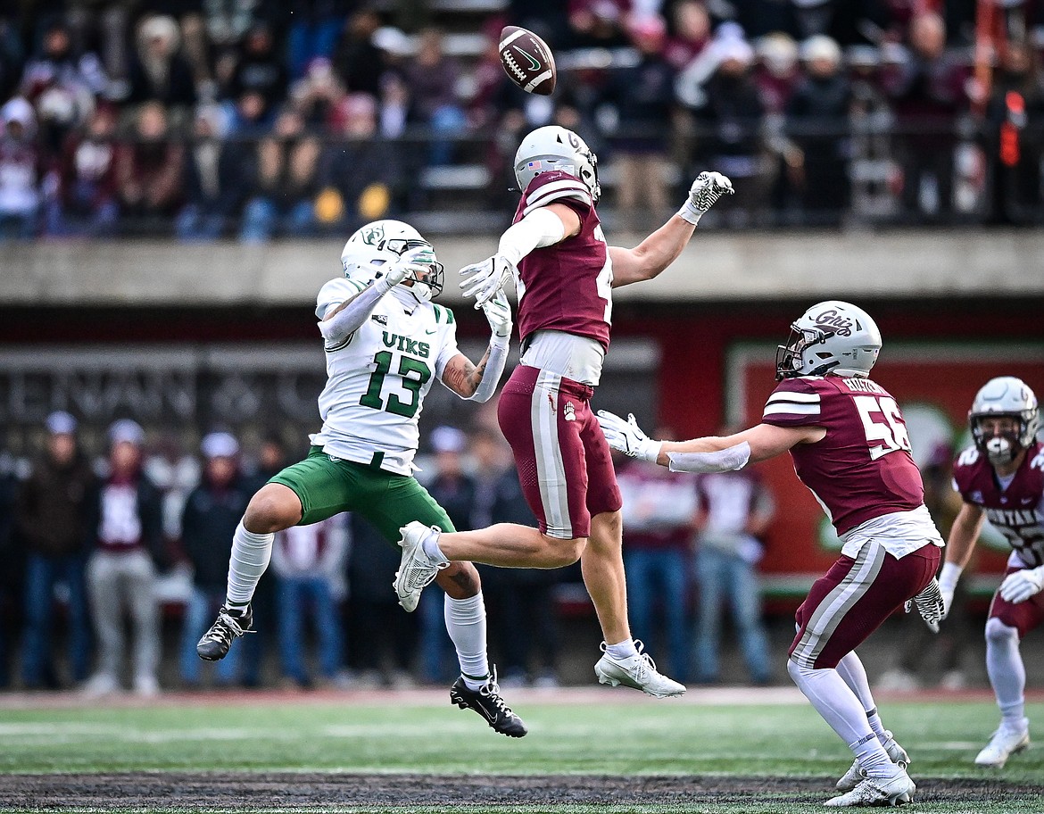 Montana linebacker Ryan Tirrell (44) deflects a pass away from Portland State wide receiver Elyjah Gordon (13) and into the arms of the Vik's Quincy Craig for a 43-yard reception in the fourth quarter at Washington-Grizzly Stadium on Saturday, Nov. 16. (Casey Kreider/Daily Inter Lake)