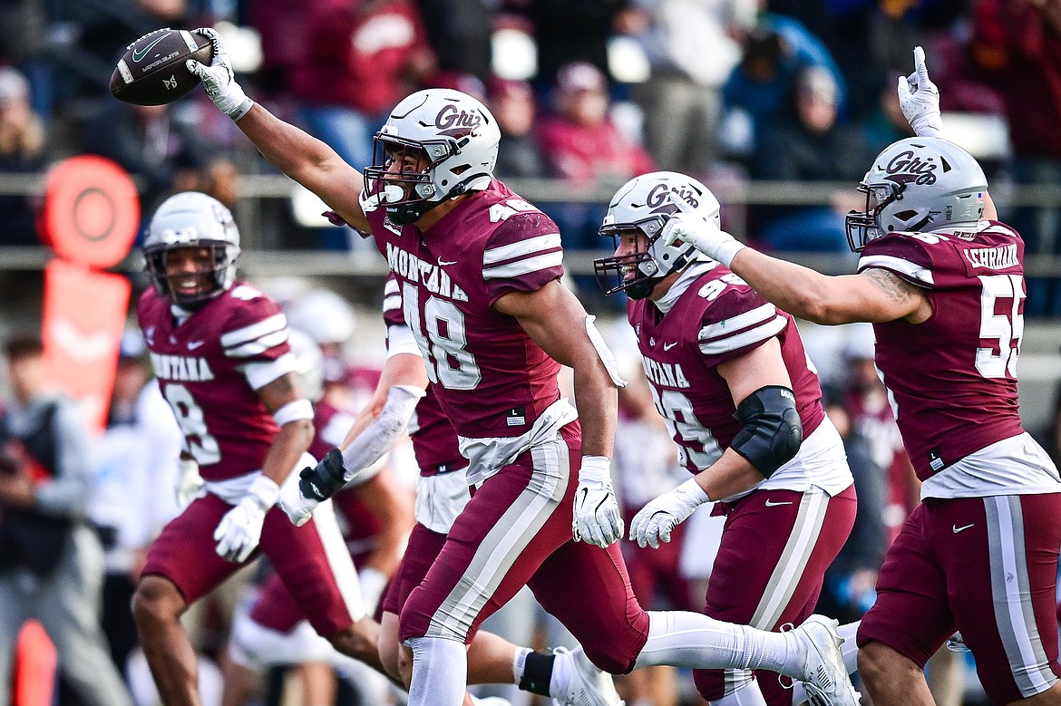 Grizzlies defensive end Hayden Harris (48) celebrates with teammates after recovering a fumble by Portland State quarterback Dante Chachere in the fourth quarter at Washington-Grizzly Stadium on Saturday, Nov. 16. (Casey Kreider/Daily Inter Lake)