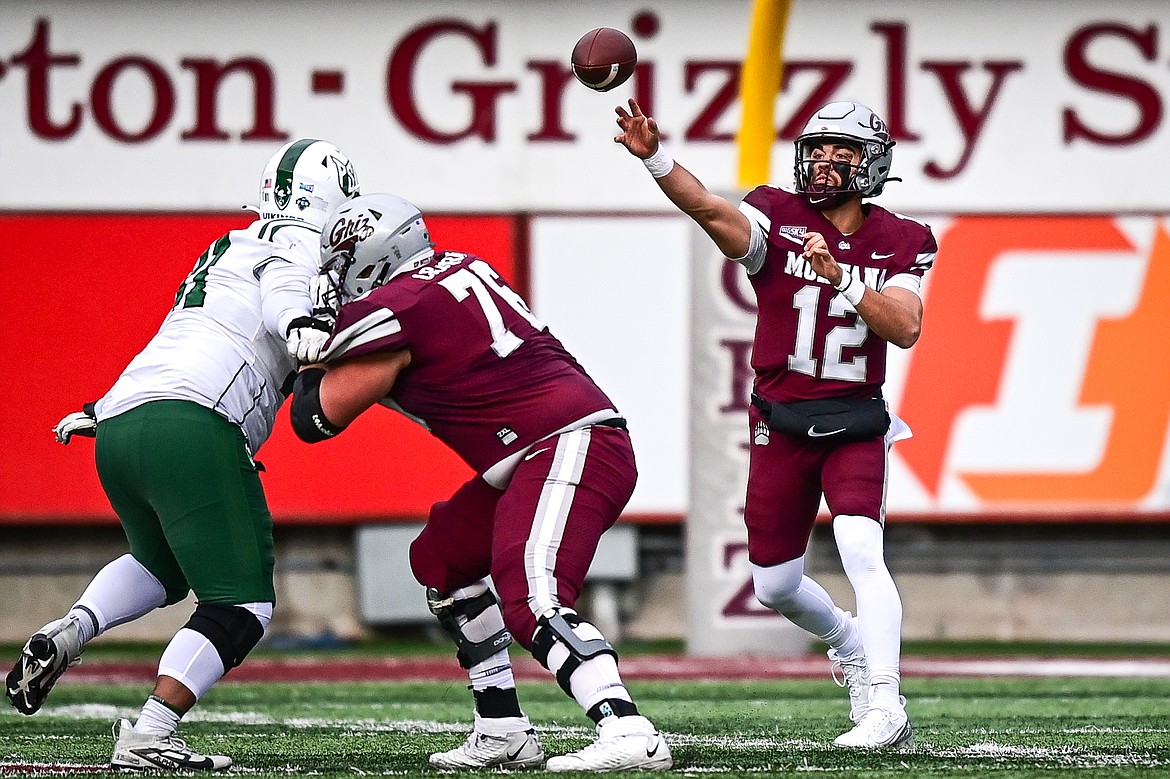 Grizzlies quarterback Logan Fife (12) completes an 15-yard pass to wide receiver Aaron Fontes in the third quarter against Portland State at Washington-Grizzly Stadium on Saturday, Nov. 16. (Casey Kreider/Daily Inter Lake)