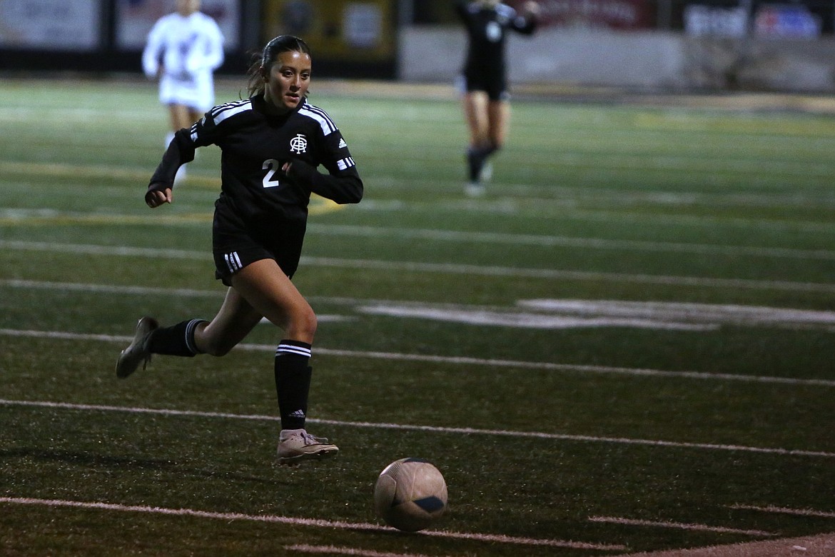 Royal freshman Bella Villafana (2) chases after the ball during a match against Kiona-Benton on Oct. 29.