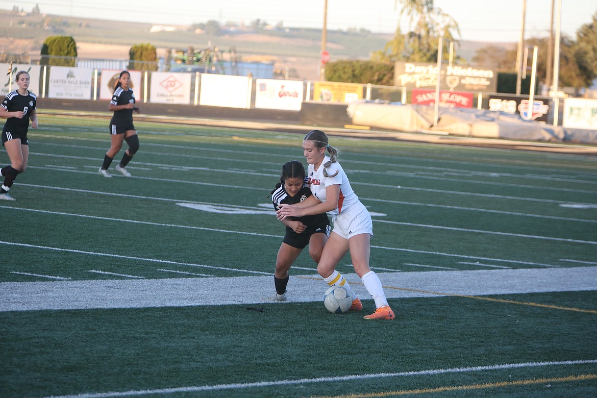 Royal junior Sharon Arroyo, left, defends a College Place player during a Sept. 1 match in Royal City. The Knights defeated the Hawks 4-1 in the district tournament.