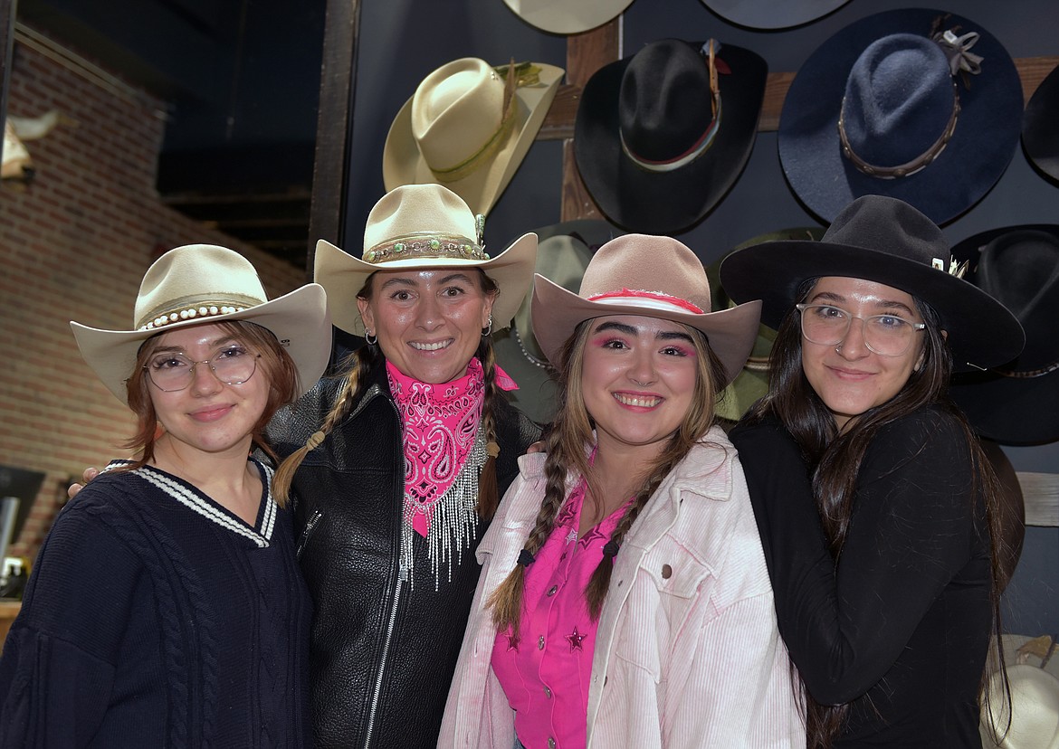 Kemo Sabe employees show off custom hats during Ladies Night. (Kelsey Evans/Whitefish Pilot)