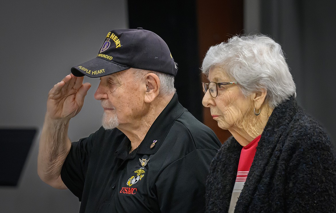 Purple Heart recipient Denis Munson and World War II veteran Betty Meyer stand for the Star-Spangled Banner. (Tracy Scott/Valley Press)