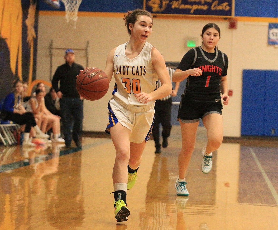 Clark Fork High senior Hannah Thompson dribbles downcourt during the Lady Cats' home matchup against Lakeside on Tuesday night.