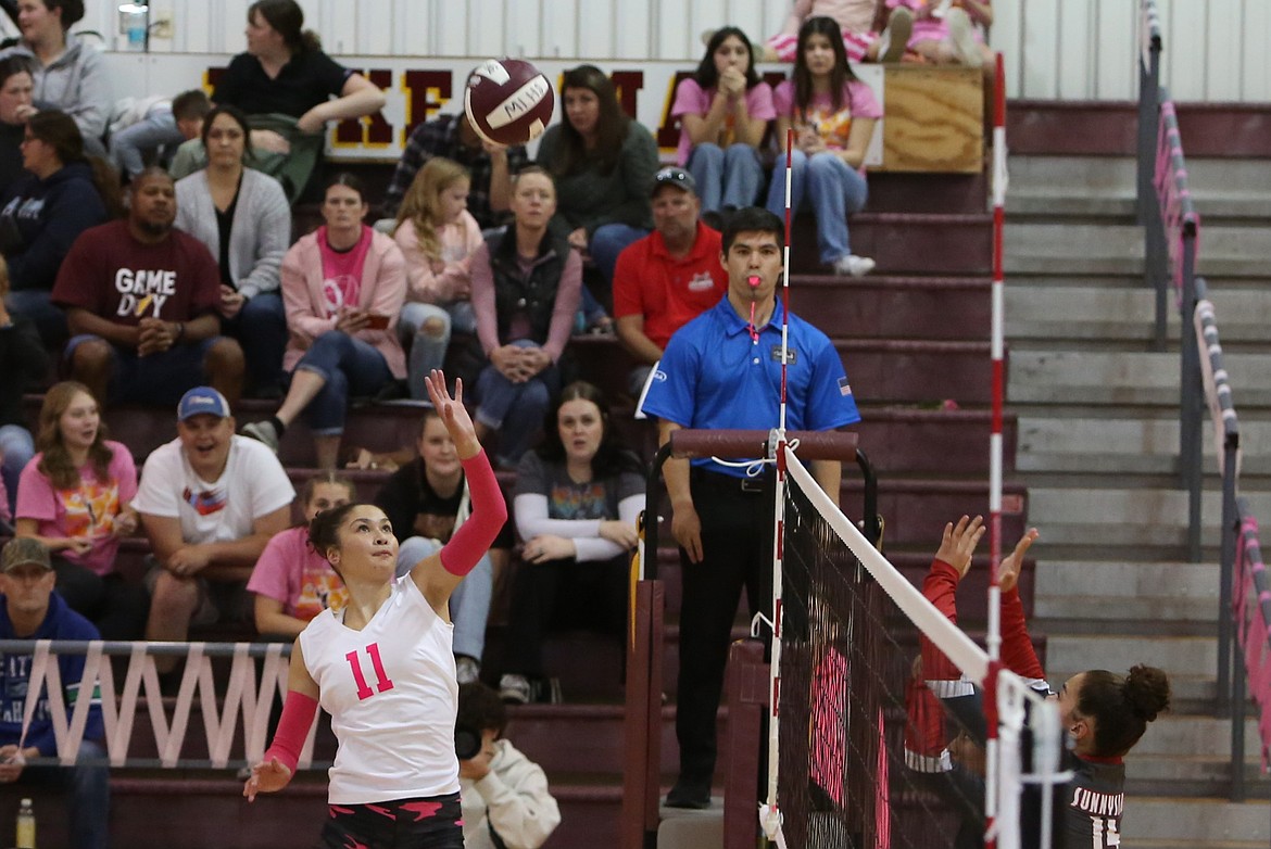 Moses Lake senior Madison Bond (11) tips the ball over the net during an Oct. 10 match against Sunnyside.