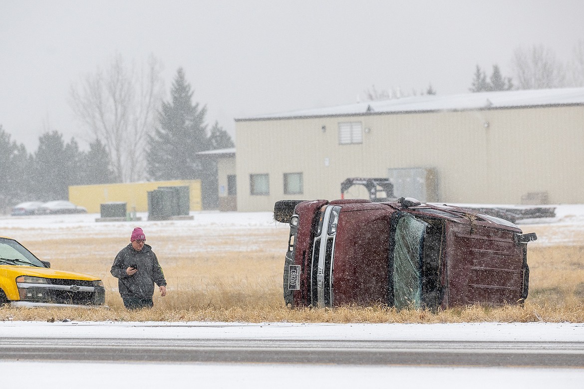 A person looks at a wreck on Highway 2 at LaSalle Wednesday morning. (Chris Peterson photo)