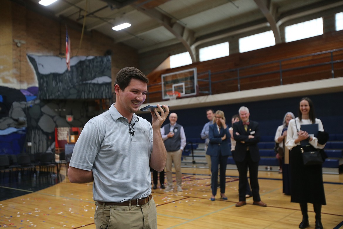 Surrounded by beaming colleagues and administrators, Lakes Middle School eighth grade math teacher Marcus Ross calls his mom Wednesday morning to tell her he won a Milken Educator Award, a national honor that recognizes innovative instructional practices and exceptional leadership.