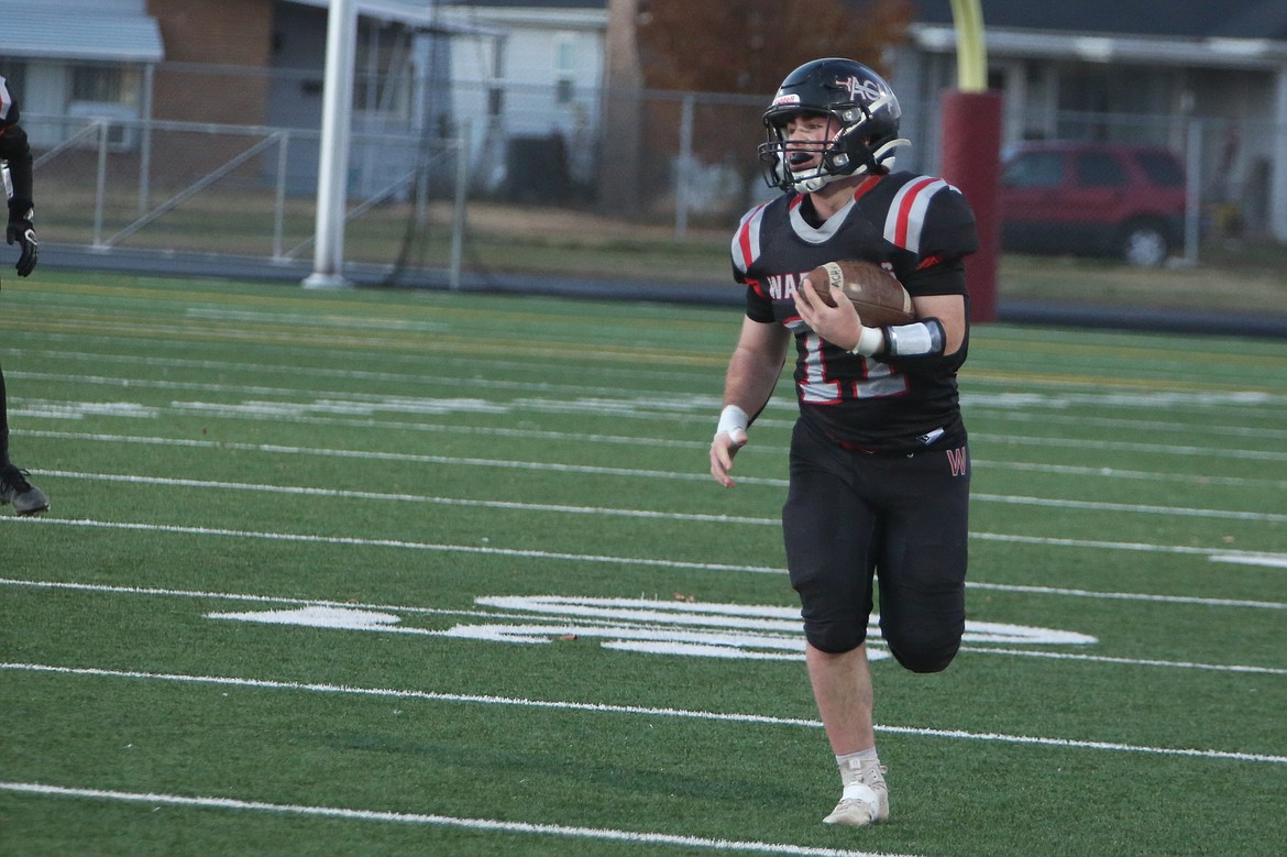 Almira/Coulee-Hartline senior Carter Pitts runs with the ball in the first half against Inchelium on Friday. Pitts has run for over 1,000 yards this season.