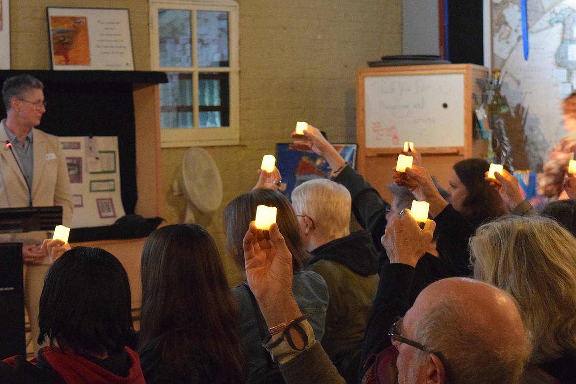 Attendees of Wednesday night's remembrance ceremony held tea lights in honor of those lives lost to suicide and transphobic violence over the past year.