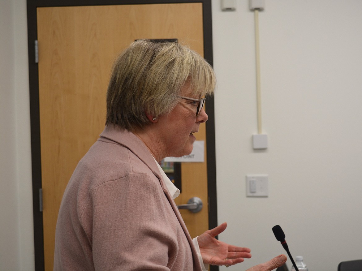 Community Library Network trustee candidate Michelle Lippert addresses the packed conference room in Athol Public Library.