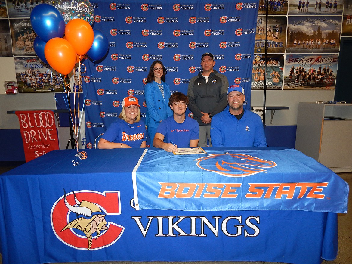 Courtesy photo
Coeur d'Alene High senior Grant Potter recently signed a letter of intent to play golf at Boise State. Seated from left are Heidi Potter (mom), Grant Potter and Andy Potter (dad); and standing from left, Victoria Beecher, Coeur d'Alene High athletic director; and Chase Bennett, Coeur d'Alene High boys golf coach.