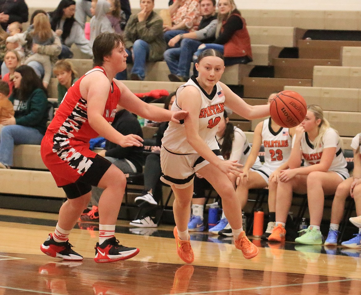 Priest River High sophomore Haylee Jepson dribbles by Kootenai's Harleigh Dutton during Thursday's matchup.