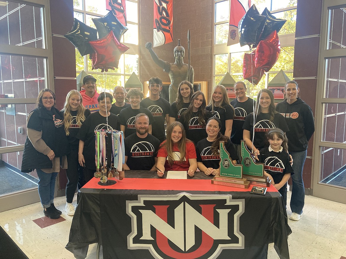 Courtesy photo
Post Falls High senior Lexi Norisada recently signed a letter of intent to play volleyball at NCAA Division II Northwest Nazarene University in Nampa. In the front row from left are John Norisada, Lexi Norisada, Jenny Norisada and Madi Ashton; and back row from left, Toni Hardy, Madison Valenta, Drew Pascua, Jean Crouch, Jim Crouch, Sawyer Norisada, Gio Carlino, Kaydence Green, Lizzy Hardy, Bevin Green, Stephanie Wideman, Lauren Ashton and Casey Cornett.