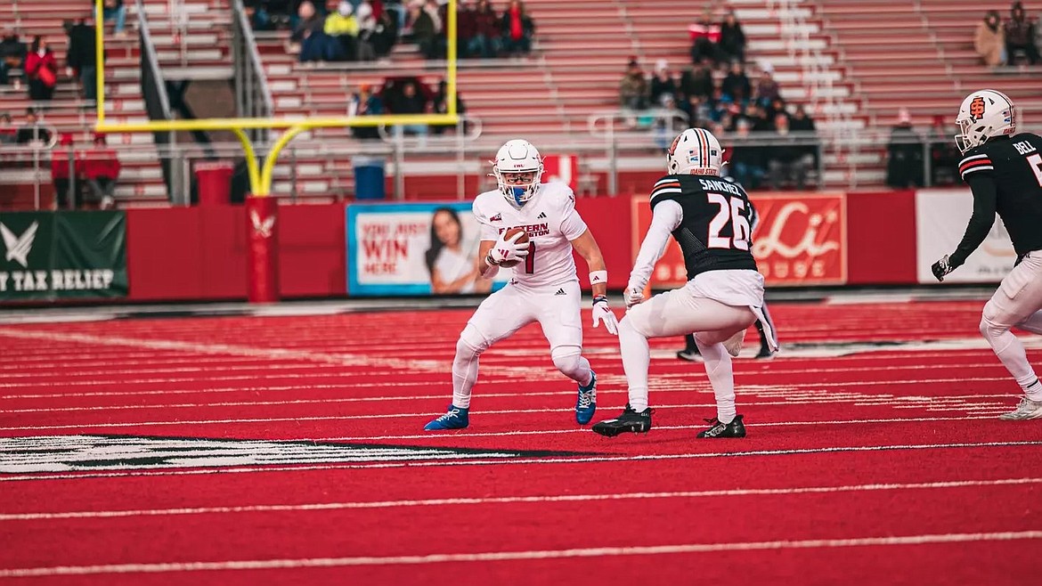 Eastern Washington receiver Efton Chism III, left, looks to make a defender miss during last week’s game against Idaho State. EWU takes on No. 21 Northern Arizona on Saturday.