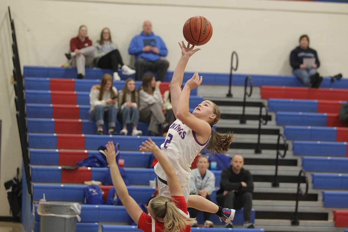 JASON ELLIOTT/Press
Coeur d'Alene freshman guard Lexi Wheeler jumps for a layup as Owyhee's Madi Brooks defends during the first quarter of Friday's game at Viking Court.