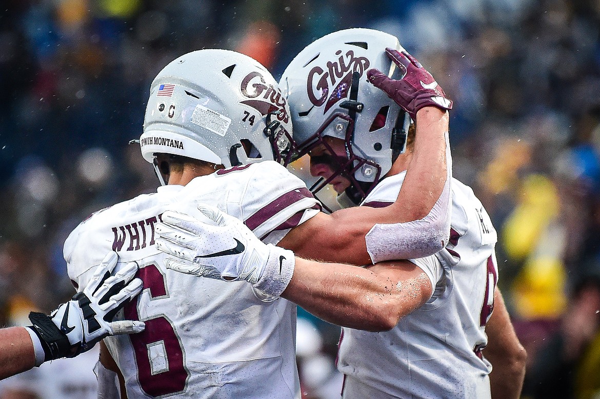 Grizzlies wide receivers Keelan White (6) and Sawyer Racanelli (9) celebrate after a touchdown reception by Racanelli in the fourth quarter against the Bobcats during the 123rd Brawl of the Wild at Bobcat Stadium on Saturday, Nov. 23. (Casey Kreider/Daily Inter Lake)