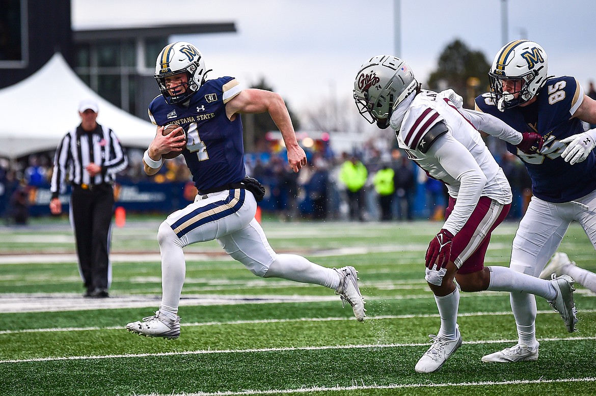 Bobcats quarterback Tommy Mellott (4) looks for running room around the edge in the fourth quarter against the Grizzlies during the 123rd Brawl of the Wild at Bobcat Stadium on Saturday, Nov. 23. (Casey Kreider/Daily Inter Lake)