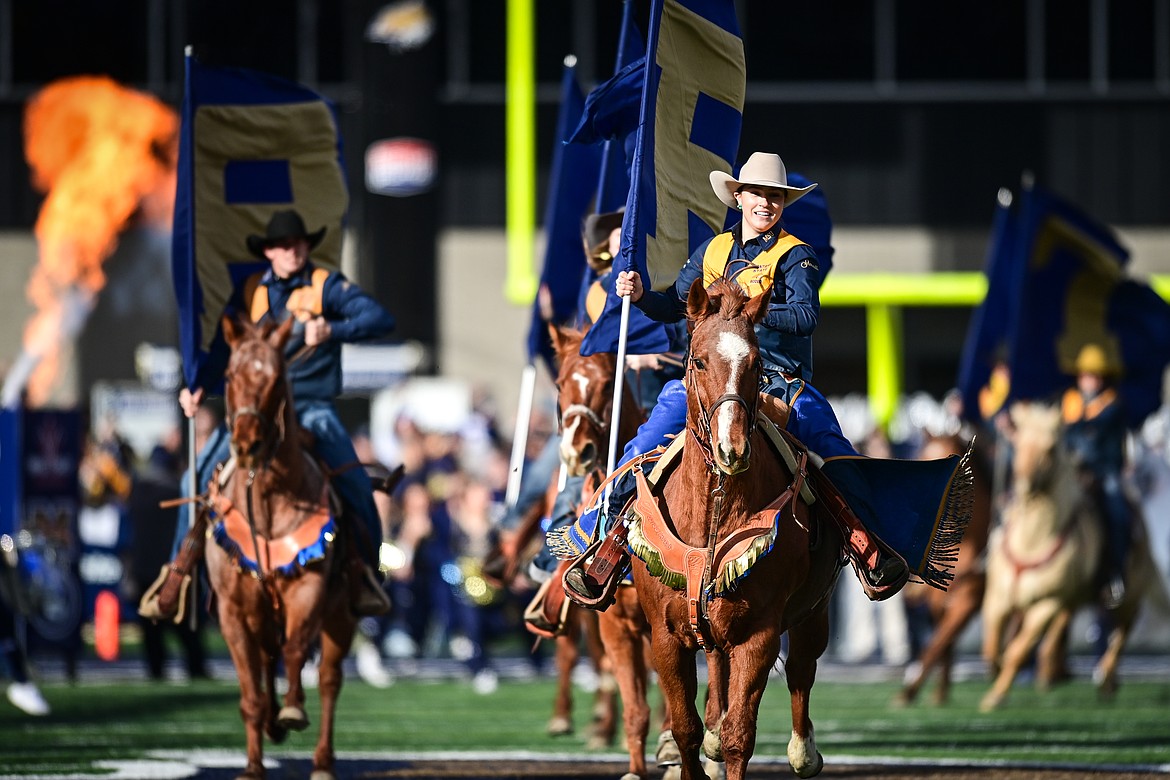 Horseback riders enter the field during the Montana State Runout before the 123rd Brawl of the Wild against the Montana Grizzlies at Bobcat Stadium on Saturday, Nov. 23. (Casey Kreider/Daily Inter Lake)