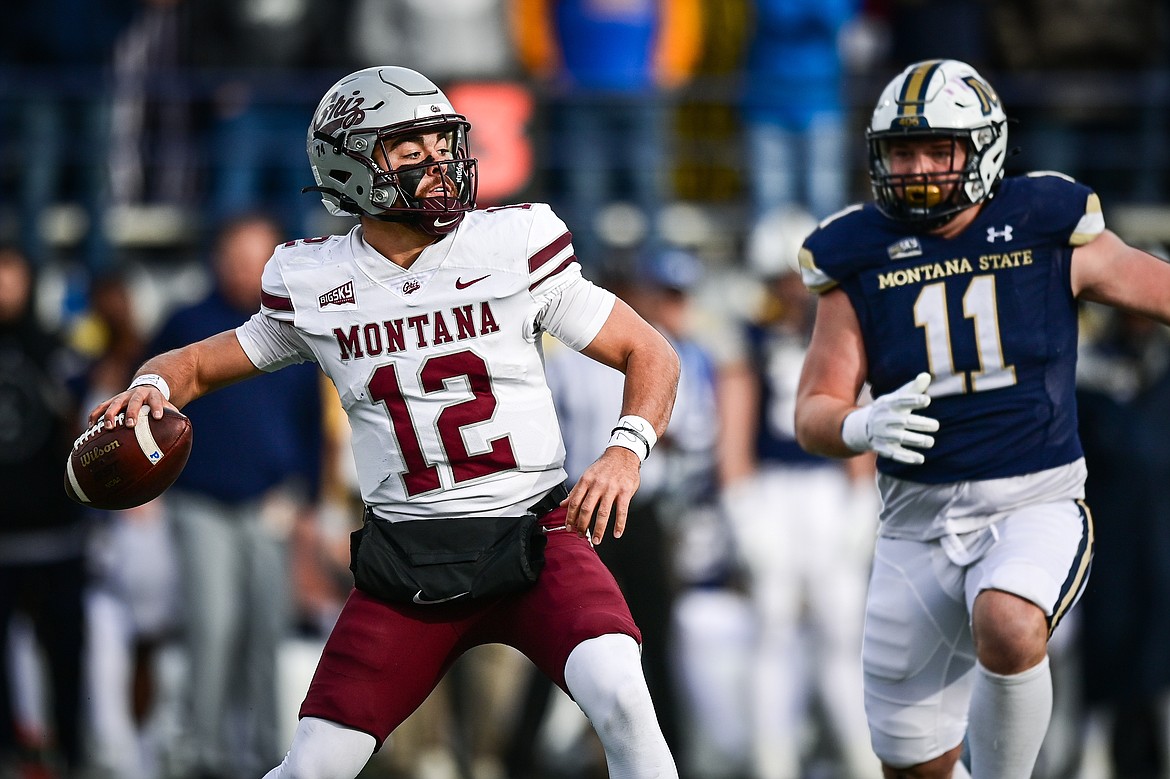 Grizzlies quarterback Logan Fife (12) drops back to pass in the second quarter against the Bobcats during the 123rd Brawl of the Wild at Bobcat Stadium on Saturday, Nov. 23. (Casey Kreider/Daily Inter Lake)