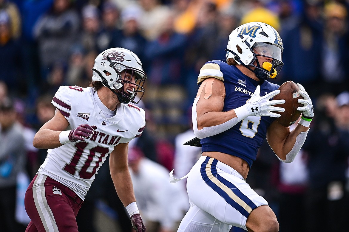 Bobcats tight end Rohan Jones (8) catches a 35-yard touchdown reception in front of Grizzlies defensive back TJ Rausch (10) in the second quarter during the 123rd Brawl of the Wild at Bobcat Stadium on Saturday, Nov. 23. (Casey Kreider/Daily Inter Lake)