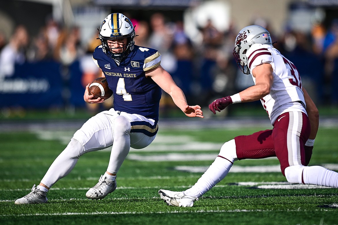 Bobcats quarterback Tommy Mellott (4) picks up yardage on a run in the first quarter against the Grizzlies during the 123rd Brawl of the Wild at Bobcat Stadium on Saturday, Nov. 23. (Casey Kreider/Daily Inter Lake)