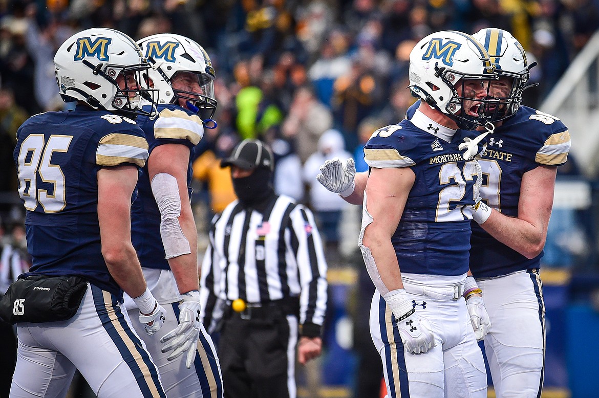 Bobcats running back Adam Jones (23) celebrates after a 2-yard touchdown run in the fourth quarter against the Grizzlies during the 123rd Brawl of the Wild at Bobcat Stadium on Saturday, Nov. 23. (Casey Kreider/Daily Inter Lake)