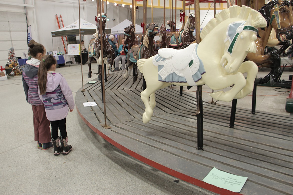 Ainzley and Luna Ahner came out to the Carouse Fun Fair to catch a glimpse of the 1920 Allan Herschell 36 pony carousel at the Bonner County Fairgrounds. The Golden Age carousel served as a centerpiece attraction for the event as hundreds of people attended the event to see the carousel and learn about local nonprofits.