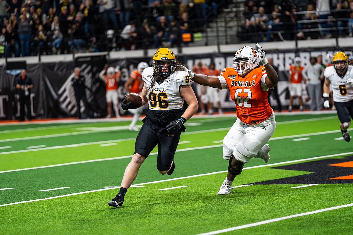 Photo by IDAHO ATHLETICS
Zach Krotzer (96) of Idaho rumbles after a first-half interception against Idaho State on Saturday at the ICCU Dome in Pocatello.