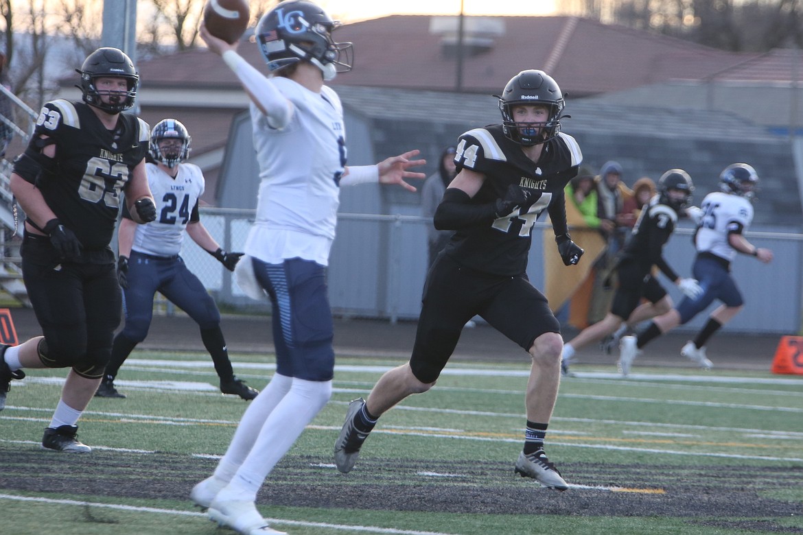 Royal senior Caden Fitzhugh (44) runs toward the Lynden Christian quarterback in the second quarter on Saturday. Fitzhugh had two sacks in the win.