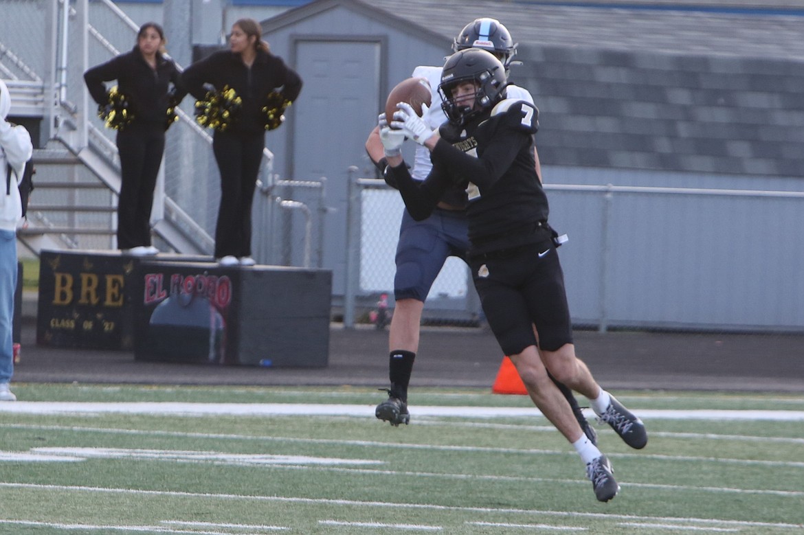 Royal sophomore Grant Wardenaar (7) intercepts a Lynden Christian pass and returns it for a touchdown in the second quarter against the Lyncs on Saturday.