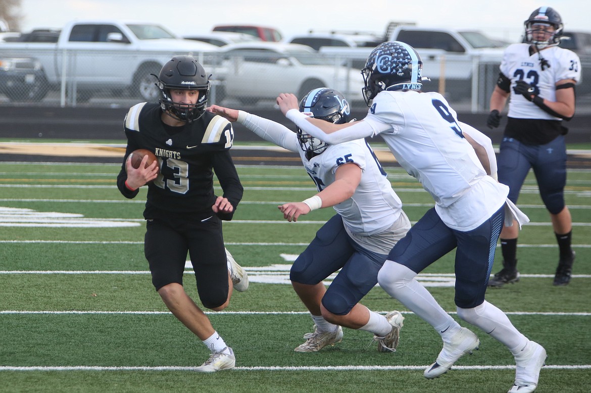 Royal senior Ezra Jenks (13) returns an intercepted pass in the first quarter. The Knights forced four turnovers in the win over Lynden Christian.