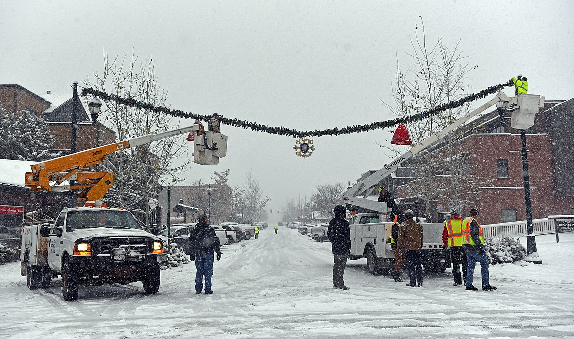 Whitefish's winter decorations were installed Sunday, Nov. 24, with help from several volunteers. (Julie Engler/Whitefish Pilot)